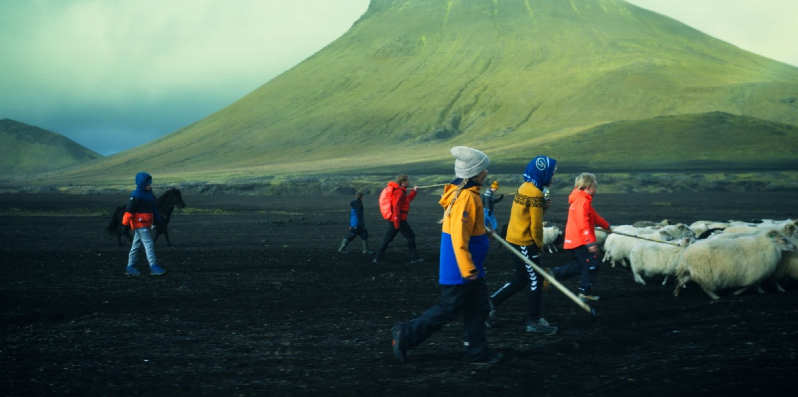 Iceland highlands during sheep round-up with farmers and stormy skies